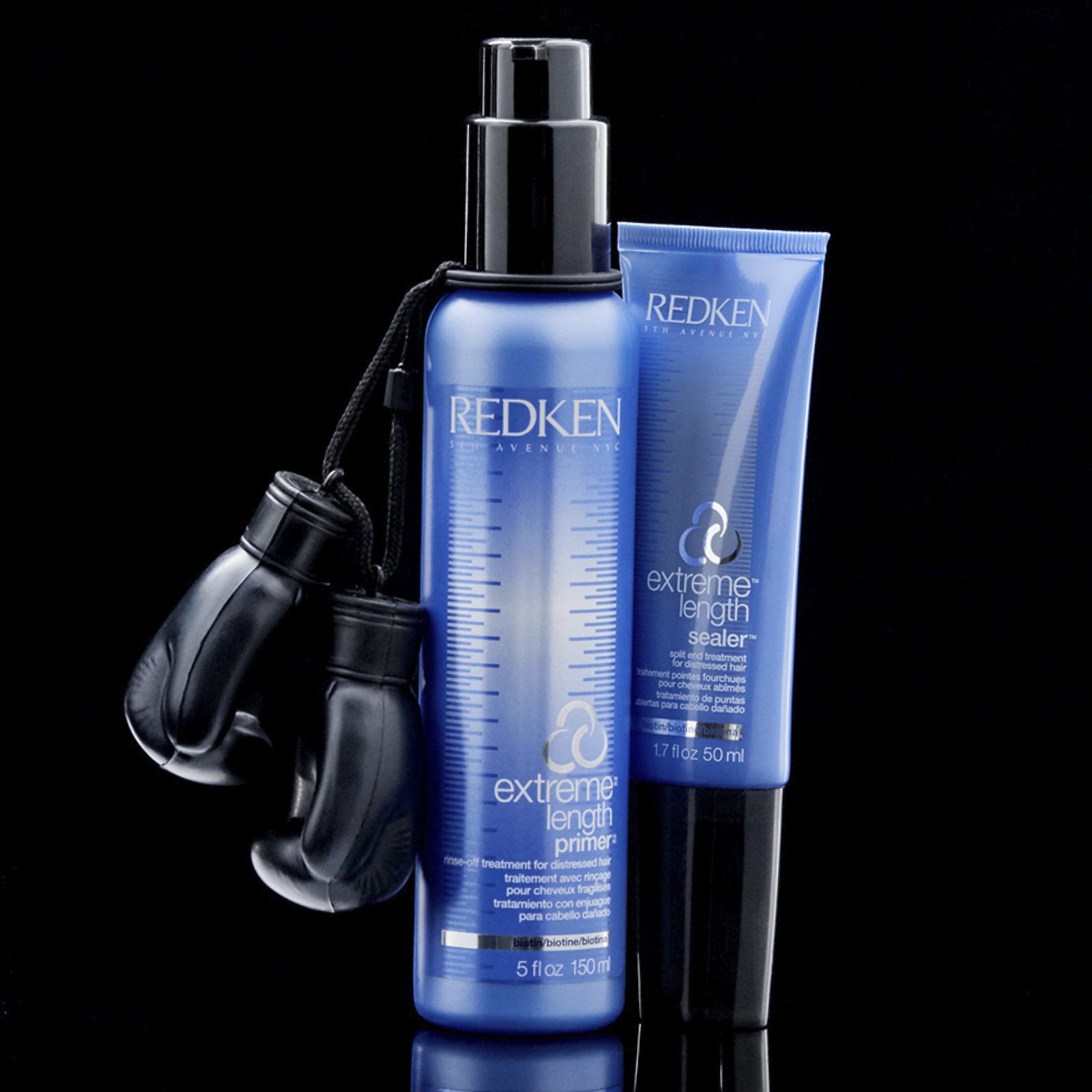 Redken Extreme Primer bredvid Extreme Split End Sealer och boxningshandske. 